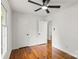 Bedroom featuring hardwood floors, ceiling fan, and easy access to closet and hallway at 1512 Anthony Dr, Gastonia, NC 28052