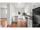 Efficient kitchen featuring stainless appliances, white cabinets, and a butcher block island at 1512 Anthony Dr, Gastonia, NC 28052