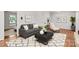 Bright living room featuring hardwood floors, neutral paint, contemporary furniture, and tasteful decor at 1512 Anthony Dr, Gastonia, NC 28052