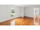 Bright living area featuring gleaming hardwood floors and abundant natural light at 1512 Anthony Dr, Gastonia, NC 28052