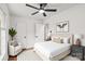 Stylized main bedroom with a ceiling fan, hardwood floors, and a large bed at 1512 Anthony Dr, Gastonia, NC 28052