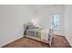 Cozy bedroom with plush carpet, a single bed, and natural light from a window at 16013 Wynfield Creek Pkwy, Huntersville, NC 28078