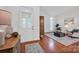 Inviting foyer with hardwood floors, a decorative front door, and a view into the bright living area at 16013 Wynfield Creek Pkwy, Huntersville, NC 28078