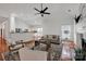 Bright open-concept living room with modern lighting and hardwood floors at 16013 Wynfield Creek Pkwy, Huntersville, NC 28078