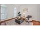 Cozy living room featuring hardwood floors, natural light, and stylish furnishings at 16013 Wynfield Creek Pkwy, Huntersville, NC 28078