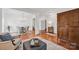Open living space featuring hardwood floors, neutral decor, and easy access to the dining area at 16013 Wynfield Creek Pkwy, Huntersville, NC 28078