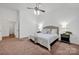 The primary bedroom offers carpeted floors, and a ceiling fan for added comfort at 16013 Wynfield Creek Pkwy, Huntersville, NC 28078