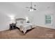 Serene primary bedroom features a ceiling fan, neutral decor, and plush carpeting at 16013 Wynfield Creek Pkwy, Huntersville, NC 28078