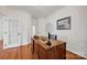 Bright home office featuring hardwood floors, natural light, and ample workspace at 16013 Wynfield Creek Pkwy, Huntersville, NC 28078