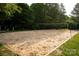 Outdoor sand volleyball court surrounded by trees at 16013 Wynfield Creek Pkwy, Huntersville, NC 28078