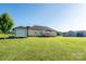 Large backyard featuring a deck, storage shed, and ample green space for recreation at 17438 Purser Dr, Locust, NC 28097