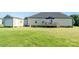 View of a large backyard featuring a back deck with an umbrella and a storage shed at 17438 Purser Dr, Locust, NC 28097