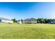 Spacious backyard with a back deck, storage shed, and plenty of room for outdoor activities at 17438 Purser Dr, Locust, NC 28097