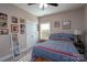 Bright bedroom features a striped bed, lots of pictures, and ample natural light from the window at 17438 Purser Dr, Locust, NC 28097
