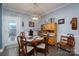 Charming dining area with wooden table and vintage decor at 17438 Purser Dr, Locust, NC 28097