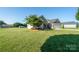 Well-maintained single-story home featuring a large, green front lawn at 17438 Purser Dr, Locust, NC 28097