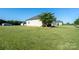 Well-maintained single-story home surrounded by a large, green lawn at 17438 Purser Dr, Locust, NC 28097