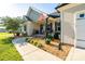 Inviting front porch with seating, landscaping, and charming decorative touches at 17438 Purser Dr, Locust, NC 28097