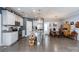 Open kitchen and dining area featuring white cabinets and stainless steel appliances at 17438 Purser Dr, Locust, NC 28097