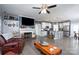 Open-concept living space featuring a fireplace, media center, kitchen, and dining area at 17438 Purser Dr, Locust, NC 28097