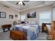 Comfortable main bedroom with a trunk at the end of the bed and natural light at 17438 Purser Dr, Locust, NC 28097