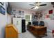 Well-lit home office featuring a safe, filing cabinet, large wooden desk, and lots of pictures at 17438 Purser Dr, Locust, NC 28097