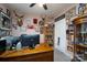 Home office with a large wooden desk, built-in bookcase, and decorated with memorabilia at 17438 Purser Dr, Locust, NC 28097