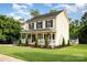 Inviting two-story home with a classic front porch and lush green lawn at 1912 Baxter St, Charlotte, NC 28204