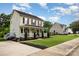 Charming two-story home featuring a welcoming front porch and well-manicured lawn at 1912 Baxter St, Charlotte, NC 28204