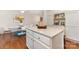 Bright kitchen featuring a white island, dining area and stainless steel appliances at 1912 Baxter St, Charlotte, NC 28204