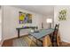 The open floorplan features wood floors and modern art and is ready for you to make it your own at 1912 Baxter St, Charlotte, NC 28204