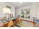 The open floorplan features wood floors and modern art and is ready for you to make it your own at 1912 Baxter St, Charlotte, NC 28204