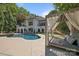 A luxurious backyard showcasing a pristine pool and shaded cabana, perfect for outdoor relaxation at 19506 Mary Ardrey Cir, Cornelius, NC 28031