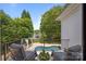 Enjoy lake views from the balcony with seating and a pool, perfect for outdoor relaxation at 19506 Mary Ardrey Cir, Cornelius, NC 28031