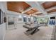 Finished basement with a pool table, wet bar, and ample seating area at 19506 Mary Ardrey Cir, Cornelius, NC 28031