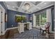 Comfortable home office with coffered ceilings, dark blue walls, and natural lighting at 19506 Mary Ardrey Cir, Cornelius, NC 28031