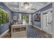 Home office with coffered ceiling, dark walls, built-in shelves, and ample workspace at 19506 Mary Ardrey Cir, Cornelius, NC 28031