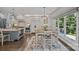 Modern kitchen with stainless steel appliances, a central island, and a breakfast nook overlooking the backyard at 19506 Mary Ardrey Cir, Cornelius, NC 28031