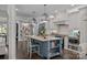 Stylish kitchen with a large island, stainless steel appliances, granite countertops, and custom cabinets at 19506 Mary Ardrey Cir, Cornelius, NC 28031