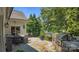 Outdoor patio with a grill and lake views, perfect for entertaining guests at 19506 Mary Ardrey Cir, Cornelius, NC 28031