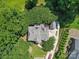 An aerial view shows a home with lush greenery, a spacious driveway, and a well-maintained roof at 2769 Independence Way, Gastonia, NC 28056