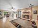 Spacious basement with a brick fireplace, windows and ceiling fan perfect for entertainment at 2769 Independence Way, Gastonia, NC 28056
