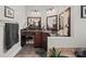 Bathroom vanity area with dual sinks, dark countertops, and dark cabinets at 2769 Independence Way, Gastonia, NC 28056