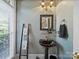 Stylish powder room featuring a pedestal sink, unique mirror, and elegant lighting at 2769 Independence Way, Gastonia, NC 28056