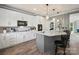 Bright kitchen boasting white cabinetry, granite countertops and stainless steel appliances at 2769 Independence Way, Gastonia, NC 28056