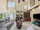 Spacious living room with fireplace, built-in shelves, and large windows with natural light at 2769 Independence Way, Gastonia, NC 28056