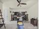 Home office with black ceiling fan, desk, cabinets, and shelving at 2769 Independence Way, Gastonia, NC 28056