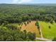 Expansive property featuring a mix of wooded areas and open fields, perfect for outdoor activities and enjoying nature at 2831 Puetts Chapel Rd, Bessemer City, NC 28016