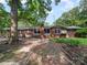Spacious backyard with brick exterior, chimney and wooden deck and wooden features at 2831 Puetts Chapel Rd, Bessemer City, NC 28016