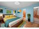 Stylishly furnished bedroom with hardwood floors, comfortable bed, and colorful decor at 2831 Puetts Chapel Rd, Bessemer City, NC 28016